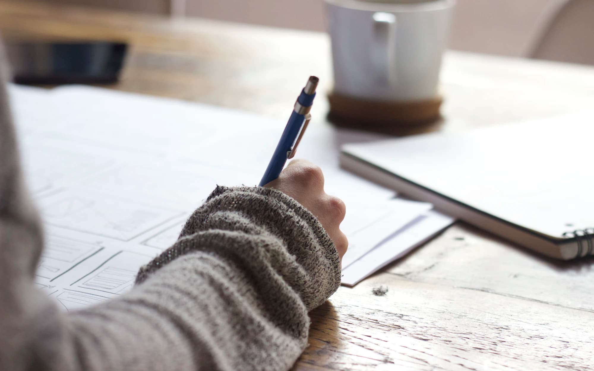 Notes and correspondence being prepared at a quiet desk